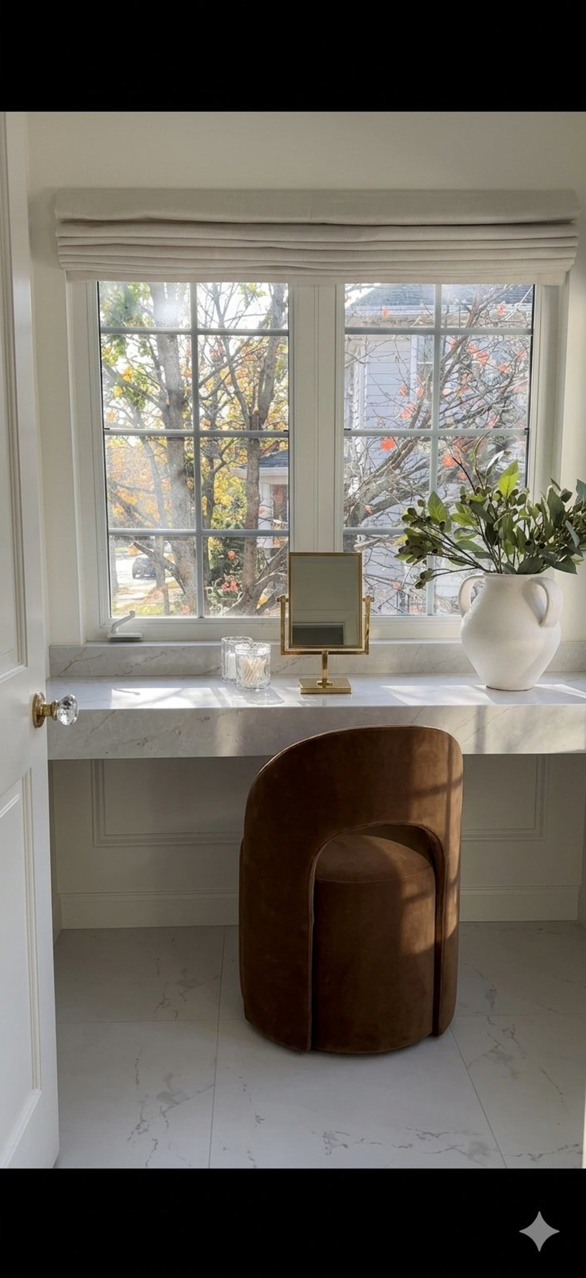 After, custom marble vanity area with velvet seating