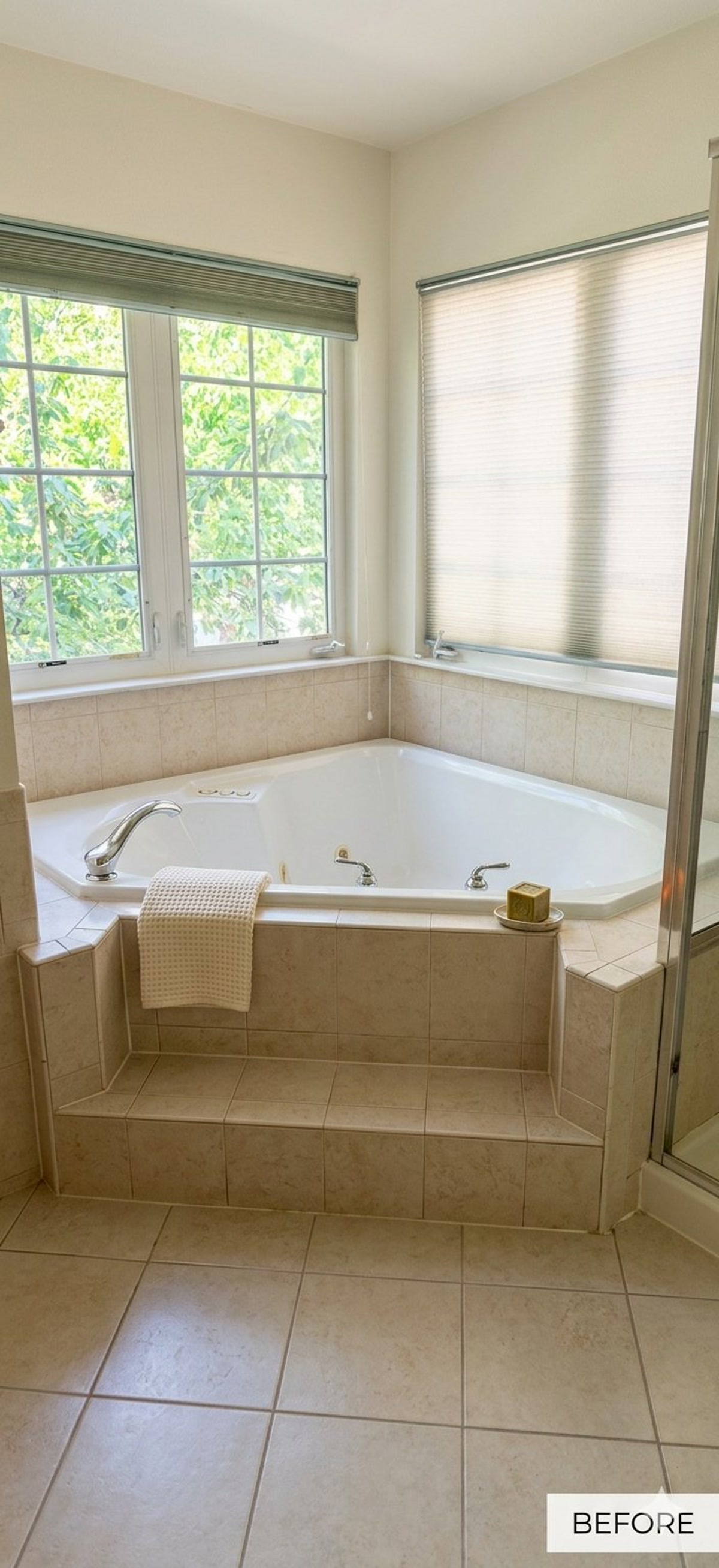 Before, dated corner soaking tub with beige tile